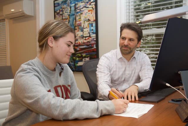Aron Boxer, M.Ed., S.P.E., working one on one with a student at a desk